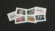 Mysteriöse Markenlogos © amazon/ NBC/ Beats/ Le Tour de France/ Toblerone/ FedEx/ Formel 1 